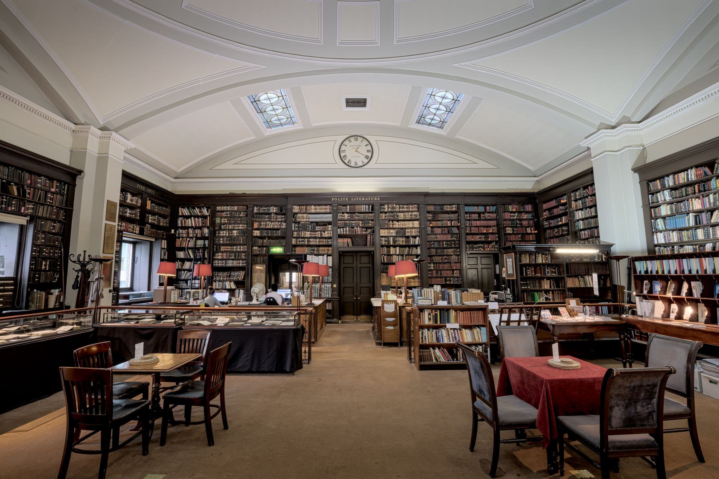 The reading room of a historic library, lined with bookshelves